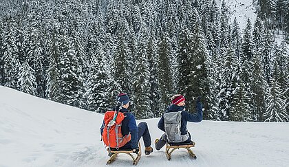 Toboggan ride during a winter holiday in Kitzbühel in Tirol