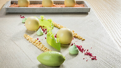 Meal with sour cream, avocado and beetroot in the toque-awarded restaurant in your sports hotel in Kitzbühel