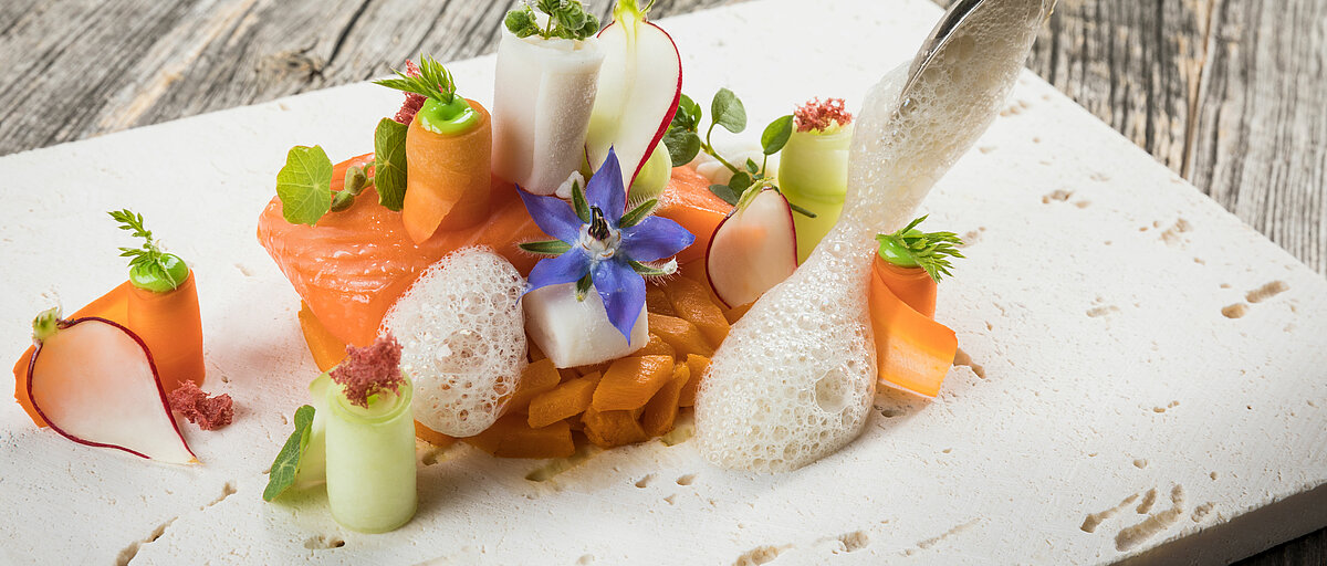 Meal in the toque-awarded restaurant in your sports hotel in Kitzbühel