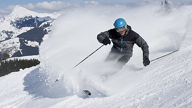 Skiing during a winter holiday in the Kitzbühel Alps in Tirol